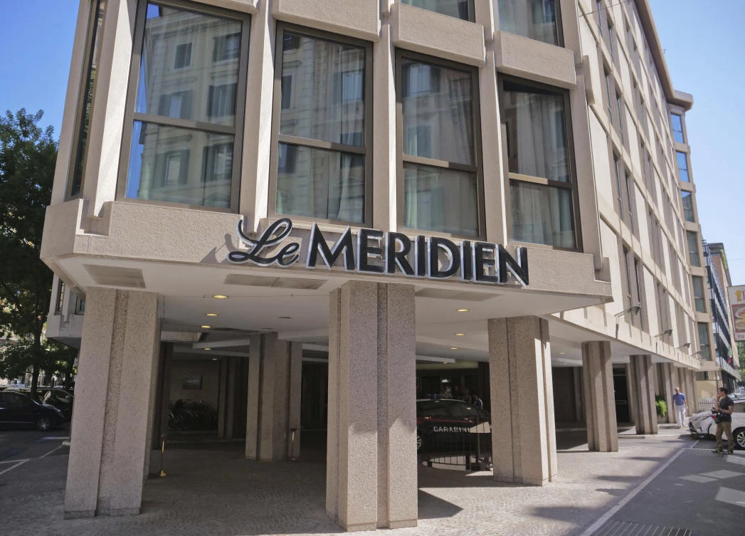 A police car stations under the Meridien hotel in Rome, where two suspects from California, Finnegan Lee Elder, 19, and Gabriel Christian Natale-Hjorth, 18, were arrested hours after Deputy Brigadier Mario Cerciello Rega, 35, was knifed 11 times to his death, Wednesday, July 31, 2019. (AP)