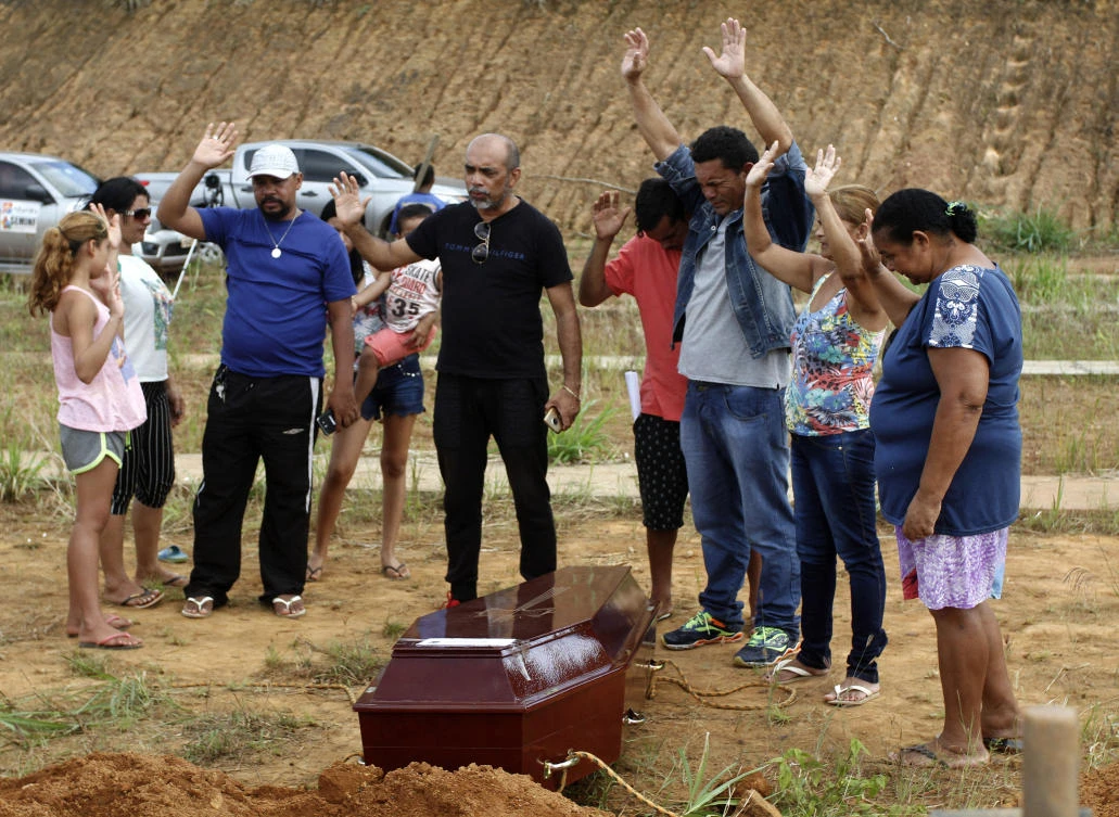 Four inmates suffocated to death en route from site of Brazil prison massacre