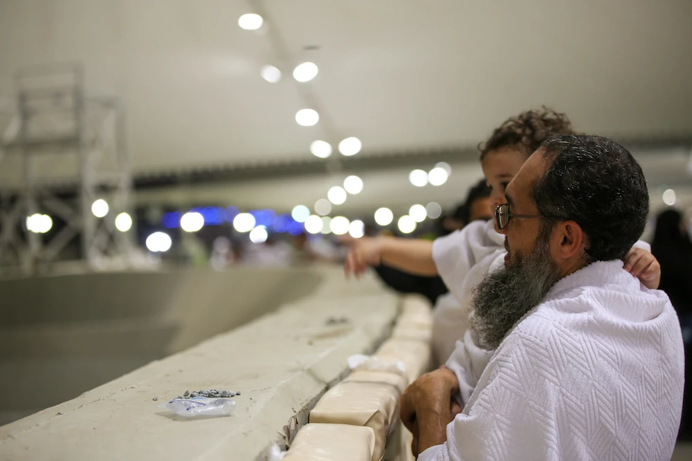 Pilgrims take part in the Jamrat Al-Aqabah ceremony, part of the Hajj pilgrimage at Islam's holiest sites, in a routine that symbolizes stoning the devil. (AN Photo/Essam Al-Ghalib)
