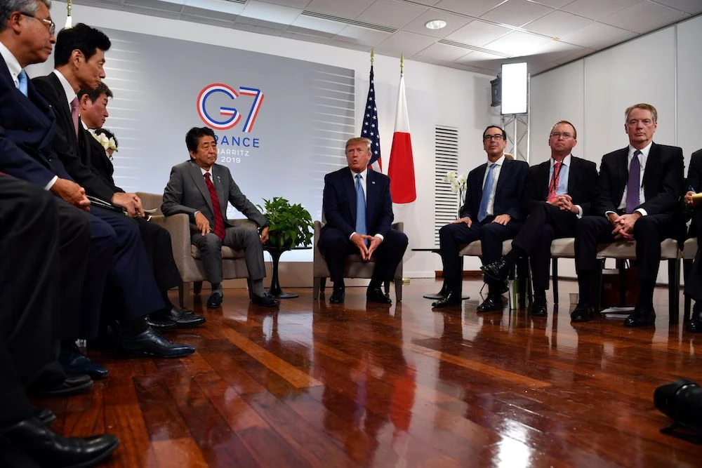Japan’s Prime Minister Shinzo Abe (L) listens as US President Donald speaks, flanked by US Treasury Secretary Steve Mnuchin (3rd from R), during a bilateral meeting at the Bellevue center in Biarritz, south-west France on Aug. 25, 2019, on the second day of the annual G7 Summit attended by the leaders of the world’s seven richest democracies, Britain, Canada, France, Germany, Italy, Japan and the United States. (AFP)