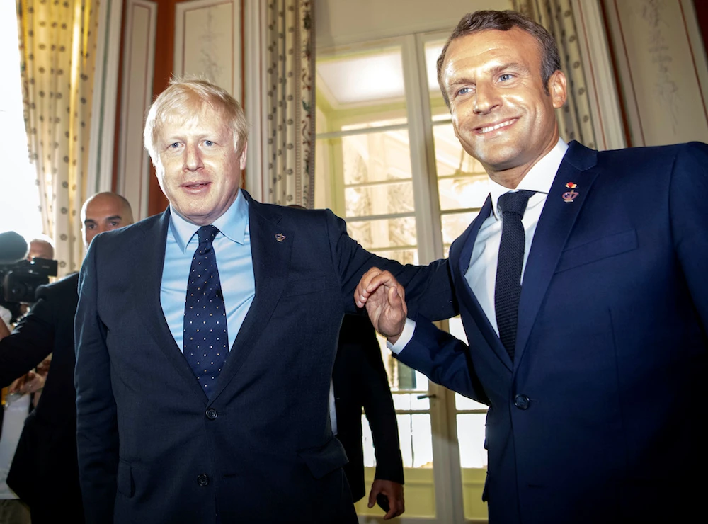 Britain's Prime Minister Boris Johnson and French President Emmanuel Macron attend the G7 summit, in Biarritz, France Aug. 24, 2019. (Reuters)