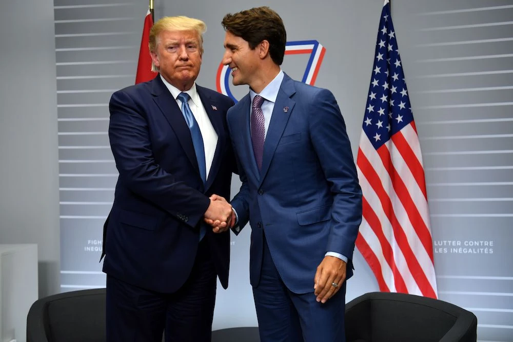 US President Donald Trump and Canada’s Prime Minister Justin Trudeau shakes hands during a bilateral meeting at the Bellevue center in Biarritz, south-west France on Aug. 25, 2019, on the second day of the annual G7 Summit. (AFP)