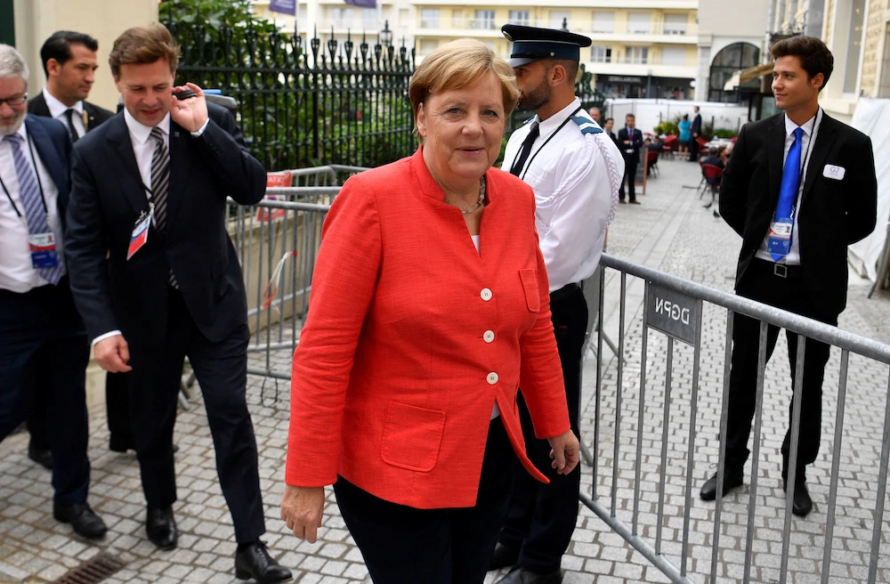 Germany’s Chancellor Angela Merkel walks during the G7 summit in Biarritz, France, 25 Aug. 2019. (Reuters)