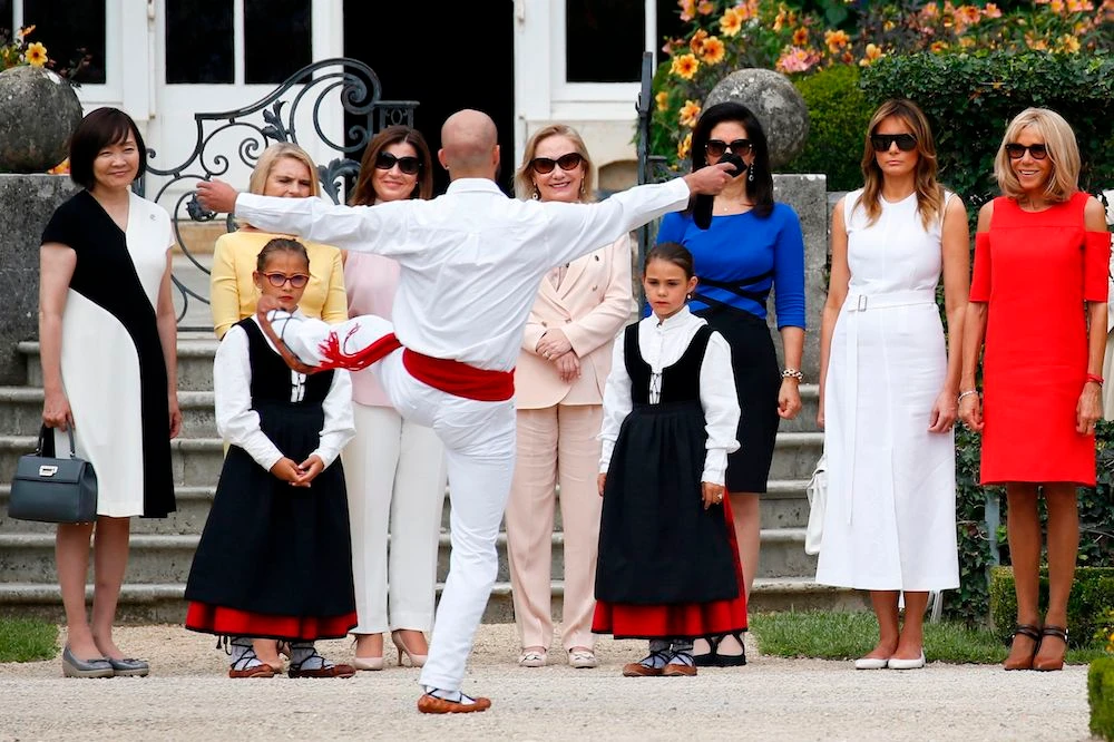 (from L) Japan’s Prime Minister’s wife Akie Abe, European Council President’s wife Malgorzata Tusk, Australia’s Prime Minister’s wife Jenny Morrison, Chile’s First Lady Cecilia Morel, President of the World Bank Group’s wife Adele Malpass, US First Lady Melania Trump and wife of French President Brigitte Macron look at traditional dance performance as they arrive at the Villa Arnaga in Cambo-les-Bains during a visit on traditional Basque culture, near Biarritz as part of the G7 summit, on Aug. 25, 2019. (AFP)