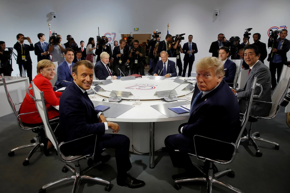 French President Emmanuel Macron, US President Donald Trump, Japan’s Prime Minister Shinzo Abe, Britain’s Prime Minister Boris Johnson, German Chancellor Angela Merkel , Canada’s Prime Minister Justin Trudeau, Italy’s acting Prime Minister Giuseppe Conte and European Council President Donald Tusk attend a G7 working session on “International Economy and Trade, and International Security Agenda” during the G7 summit in Biarritz, France, Aug. 25, 2019. (Reuters)