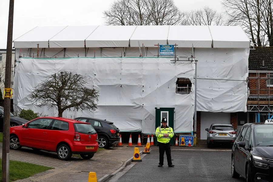 A pictures shows covered tarpaulin and scaffolding and secured by police the former home of Russian ex-spy Sergei Skripal in Salisbury, southern England on March 4, 2019 exactly one year to the day since the assissination attempt on Skripal with the nerve agent Novichok that seriously injured him and his daughter Yulia. (AFP)
