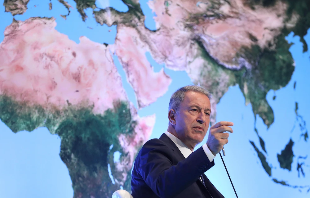 Turkey's Defense Minister Hulusi Akar addresses a meeting of his country's ambassadors, in Ankara, Turkey, Wednesday, Aug. 7, 2019. Akar says his country would like to establish a safe zone in northeast Syria jointly with the United States but would act alone if necessary.(AP)