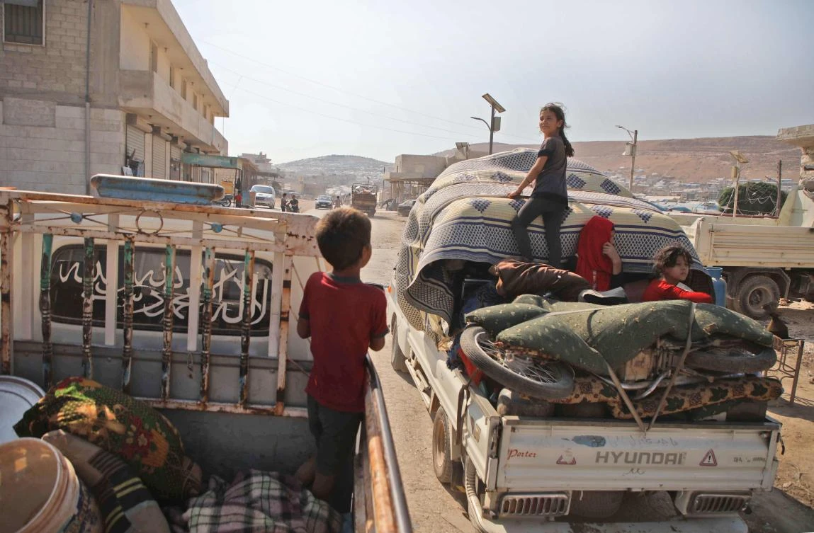 Displaced Syrians who fled from their villages near the village of Jibala in the south of Idlib province to escape bombing by Syrian government forces, return home shortly before a truce fell apart between rebels and President Bashar al-Assad's regime, on August 4, 2019. (AFP)
