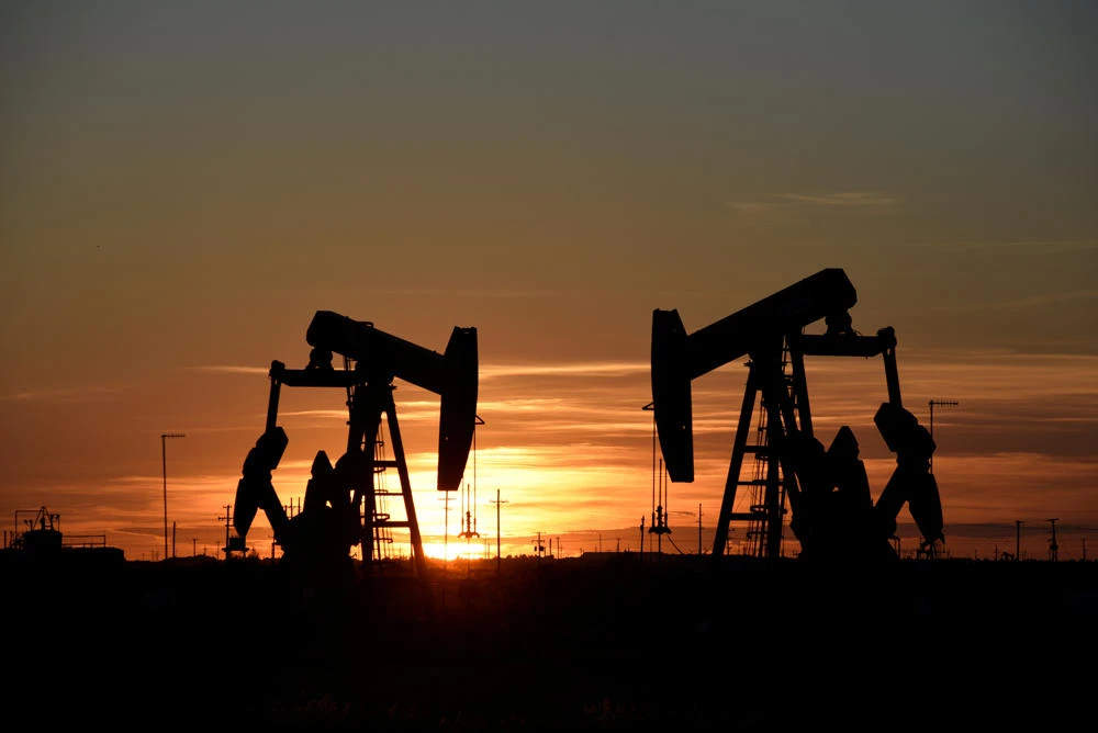 Pump jacks operate at sunset in an oil field in Midland, Texas. (REUTERS/Nick Oxford/File Photo)