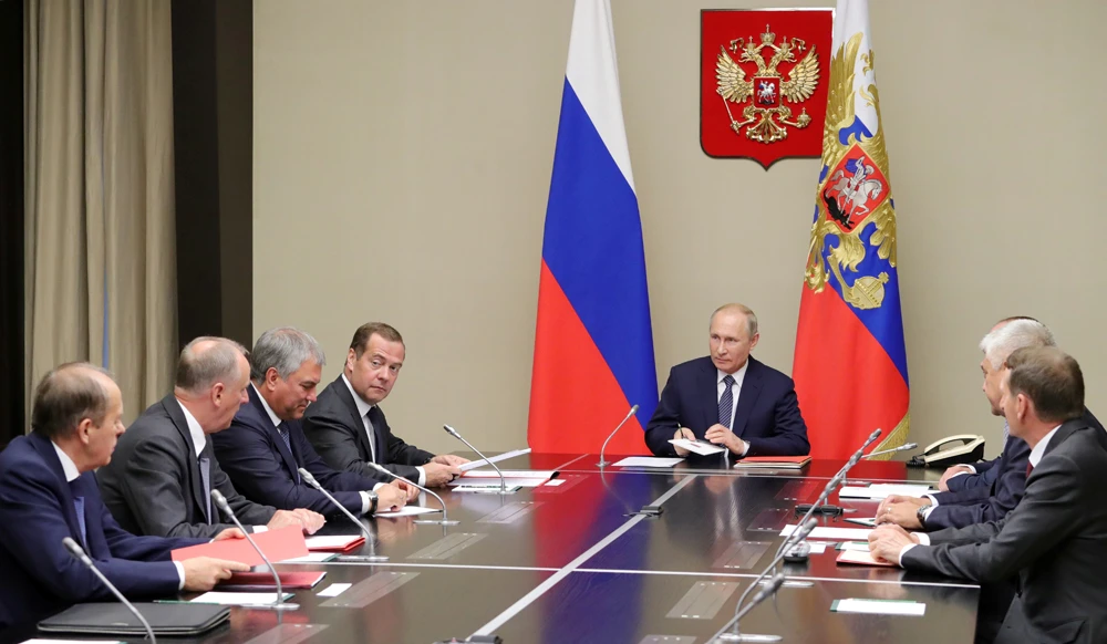 Russian President Vladimir Putin and Prime Minister Dmitry Medvedev attend a meeting with members of the Security Council at the Novo-Ogaryovo state residence outside Moscow on August 5, 2019. (Sputnik/Mikhail Klimentyev/Kremlin via REUTERS)