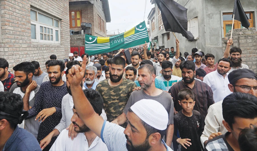 Kashmiri protesters, some of them holding black flags, shout slogans in Srinagar on Saturday. (AN photo by Masrat Zahra)