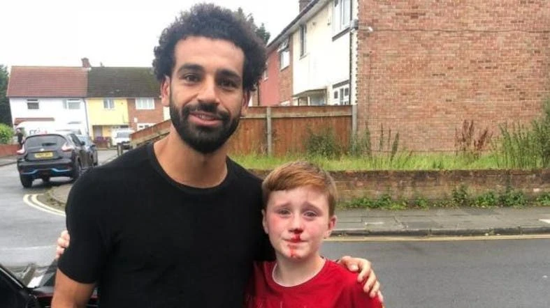 Liverpool superstar Salah circled round to check on the injured fan before offering to pose for pictures. (Twitter: @JoeCooper93)