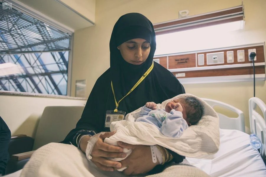 Libyan pilgrim Suad Mohammed Barbush and her baby Arafah, named after Mount Arafat. (SPA)