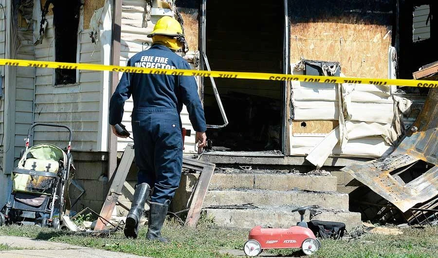 Erie Bureau of Fire Inspector Mark Polanski helps investigate a fatal fire at 1248 West 11th St. in Erie, Pa, on Sunday, Aug. 11, 2019. (AP)