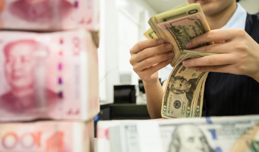 China’s yuan has weakened by almost 2.4 percent since the latest US threat to extend tariffs on Chinese goods. (AFP)