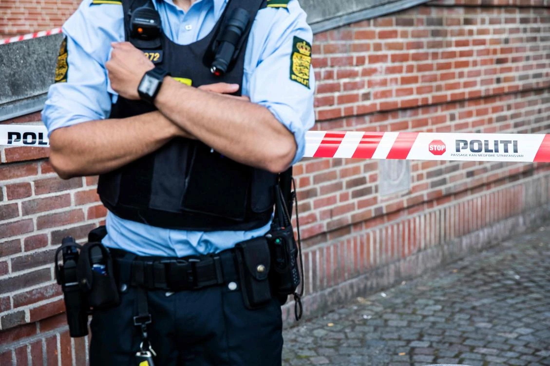 A police officers stands guard at the Danish Tax Authority at Oesterbro in Copenhagen, Denmark, on August 7, 2019, after a powerful explosion late on August 6 near Nordhavn Station damaged the building of the national tax agency. (AFP/Ritzau Scanpix/Olafur Steinar Gestsson)