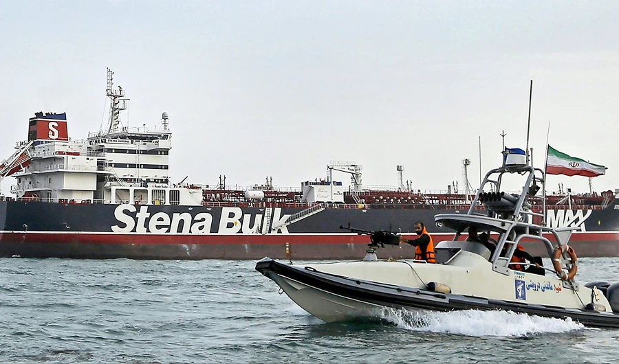 Iranian guards patrolling around the impounded British-flagged tanker Stena Impero as it is anchored off the Iranian port city of Bandar Abbas. (AFP)