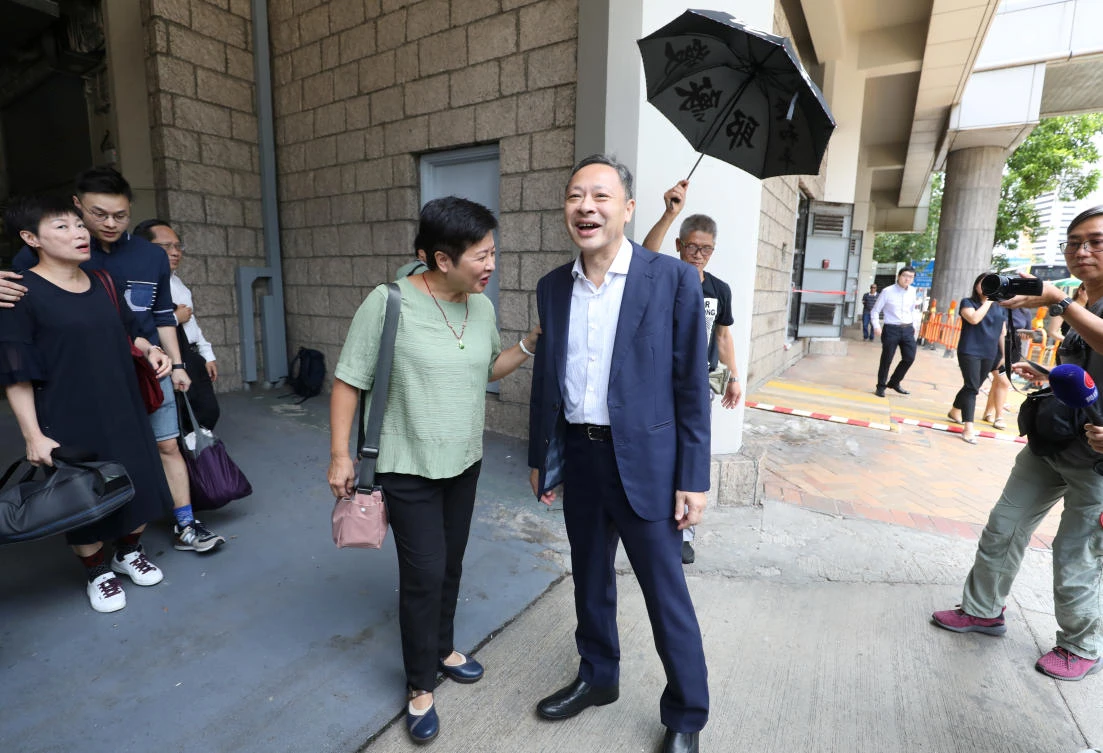 Benny Tai, right, one of the former leaders of Hong Kong’s 2014 Occupy Central pro-democracy movement leaves the high court after being released on bail. (Reuters)