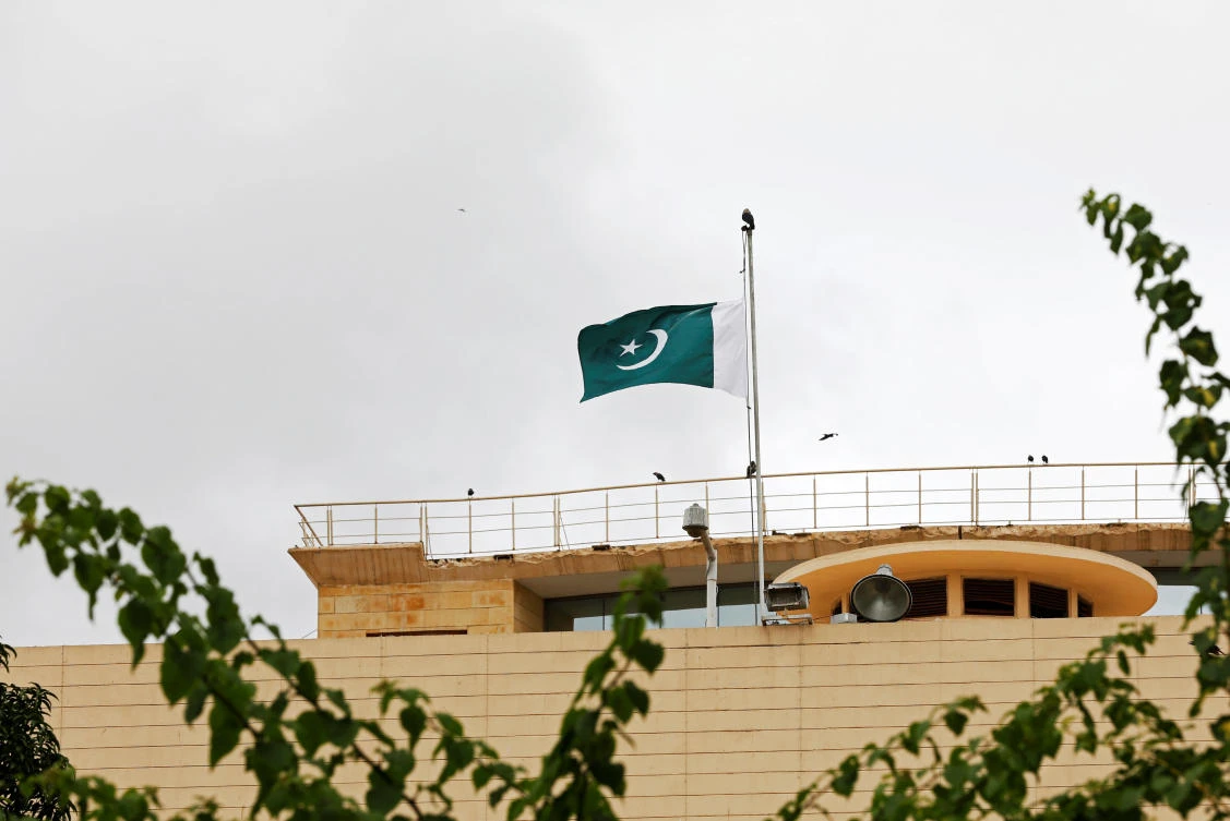 Pakistan’s flag flies at half-mast, to observe Black Day over India’s decision to revoke the special status of Jammu and Kashmir, above the Provincial Assembly of Sindh building in Karachi on August 15, 2019. (Reuters)