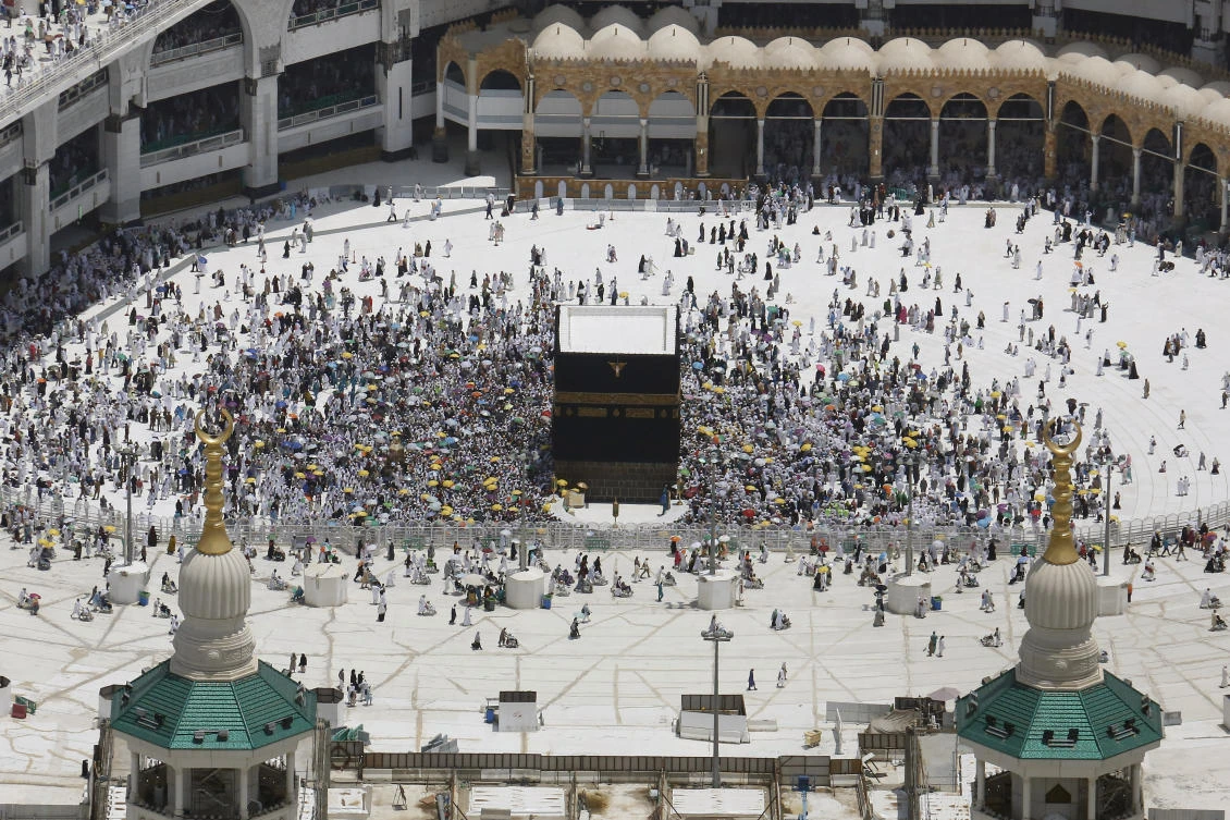 This aerial photo from a helicopter shows Muslim pilgrims circumambulate the Kaaba, the cubic building at the Grand Mosque, durning the hajj pilgrimage in the Muslim holy city of Mecca, Saudi Arabia, Monday, Aug. 12, 2019. (AP)