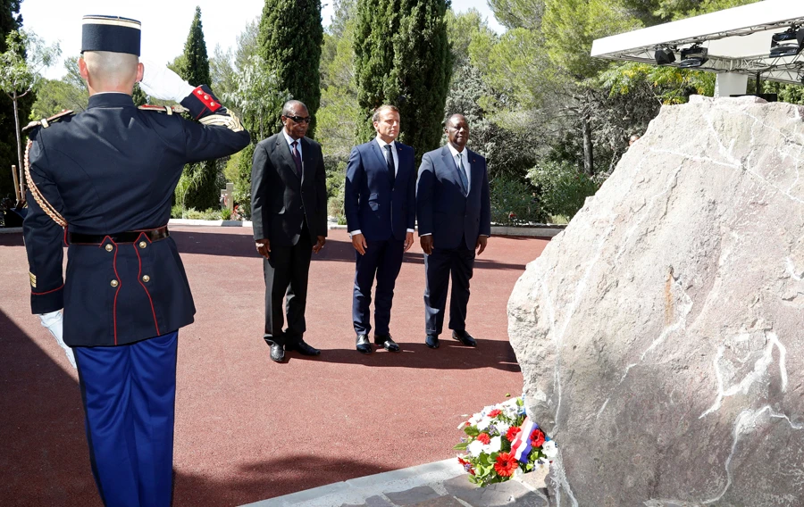 French President Emmanuel Macron, second left, Ivory Coast's President Alassane Ouattara and Guinean President Alpha Conde, left, attend a ceremony marking the 75th anniversary of the WWII Allied landings in Provence, in Saint-Raphael, southern France. (AP Photo)