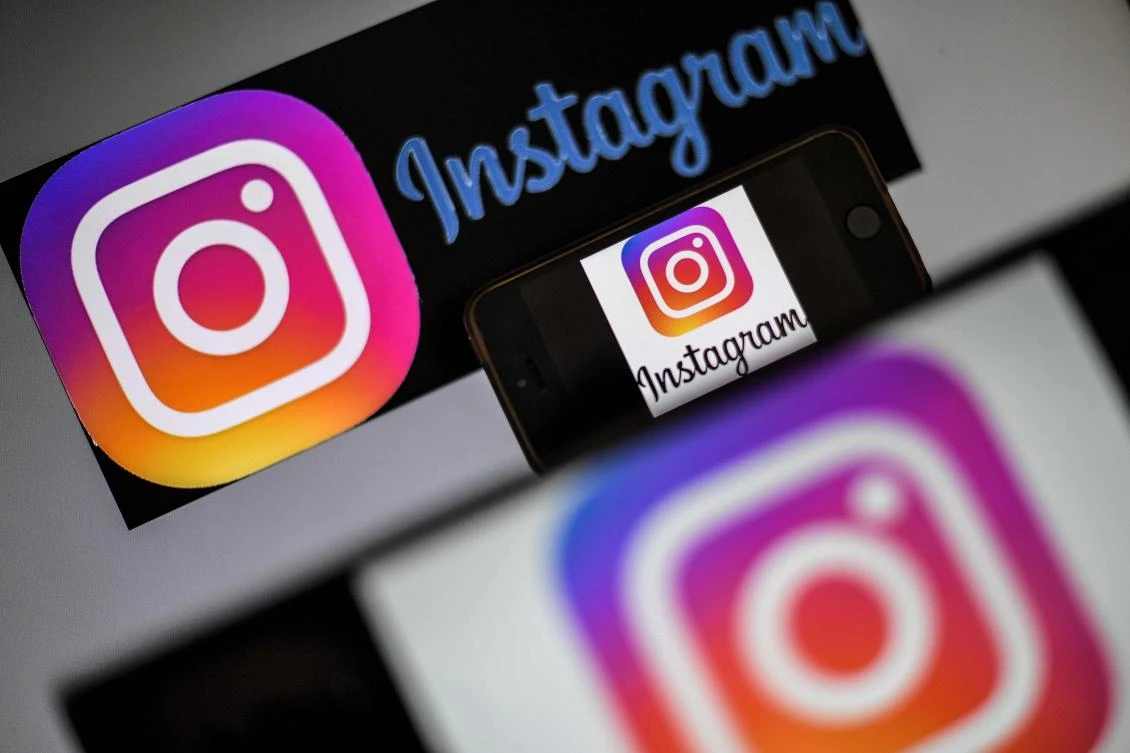 In this file photo taken on May 2, 2019 logos of US social network Instagram are displayed on a screen of a smartphone in Nantes, western France. (AFP)