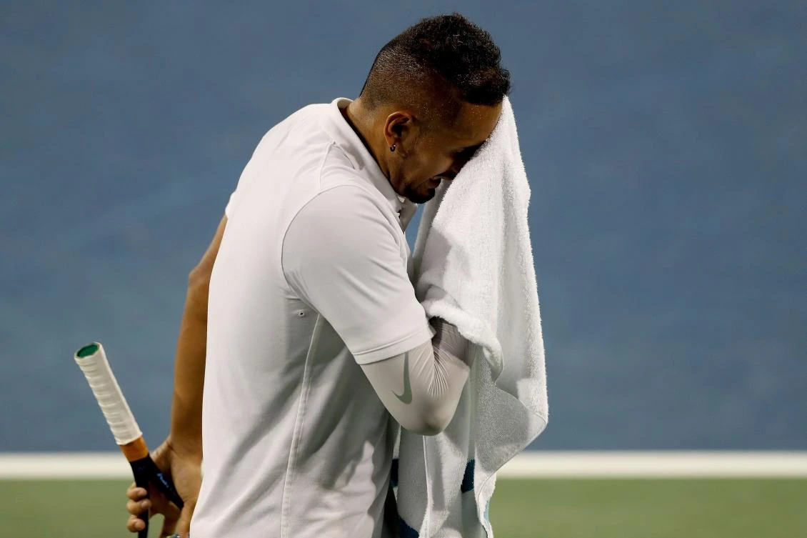 Nick Kyrgios of Australia wipes his face between points while playing Karen Khachanov of Russia during the Western & Southern Open at Lindner Family Tennis Center in Mason, Ohio. (AFP)
