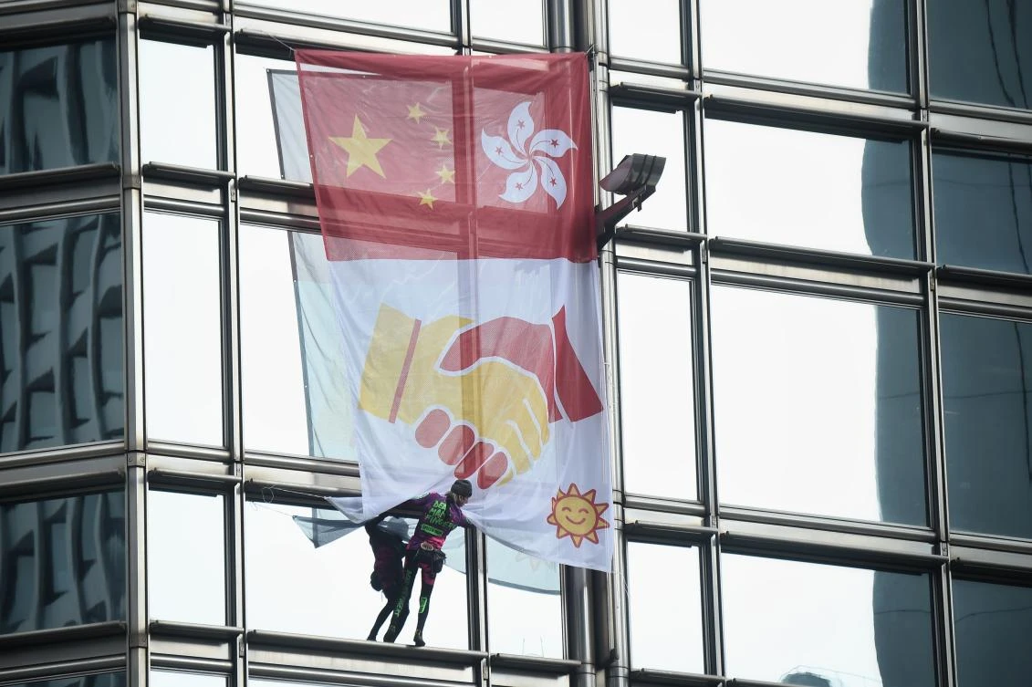 ‘French Spiderman’ scales Hong Kong skyscraper with ‘peace banner’