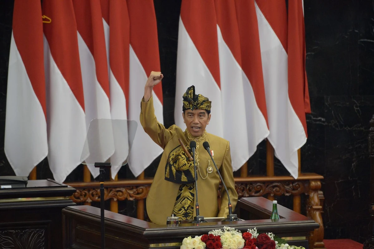 Indonesia's President Joko Widodo, dressed in a traditional outfit from West Nusa Tenggara, gestures during his state-of-the-nation address at a general assembly at parliament in Jakarta on August 16, 2019. (AFP)