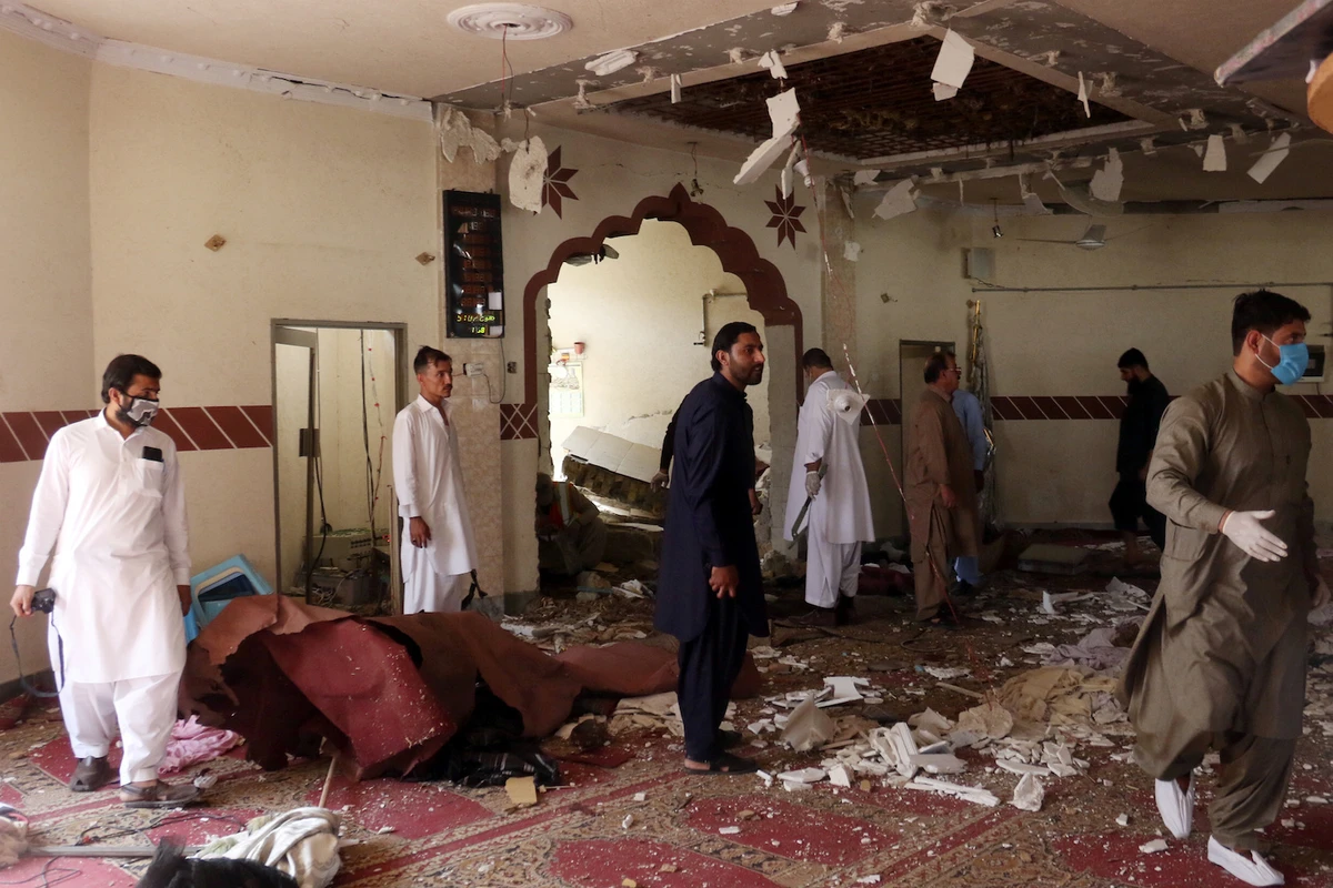 Members of a bomb disposal unit survey the site after a blast at a mosque in Kuchlak, in the outskirts of Quetta, Pakistan August 16, 2019. (Reuters)