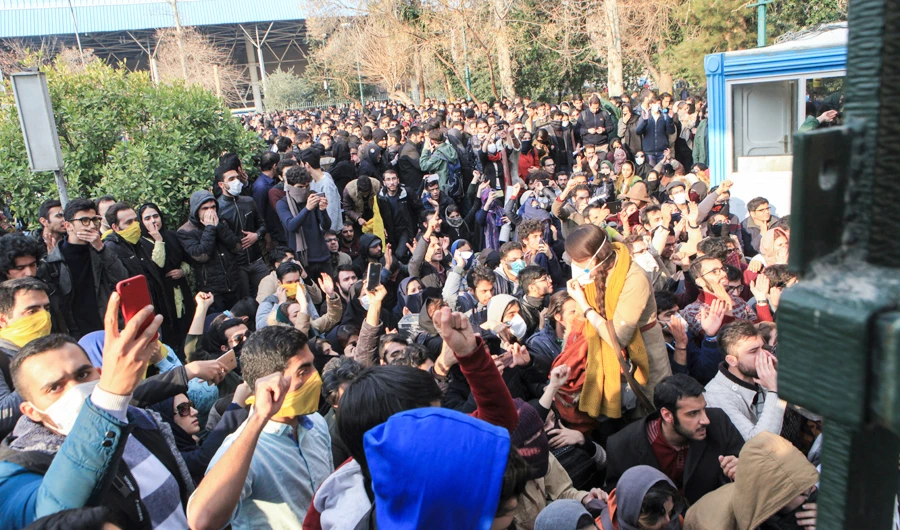 In this Saturday, Dec. 30, 2017 file photo taken by an individual not employed by the Associated Press and obtained by the AP outside Iran, university students attend a protest inside Tehran University while anti-riot Iranian police prevent them to join other protestors, in Tehran, Iran. (AP)