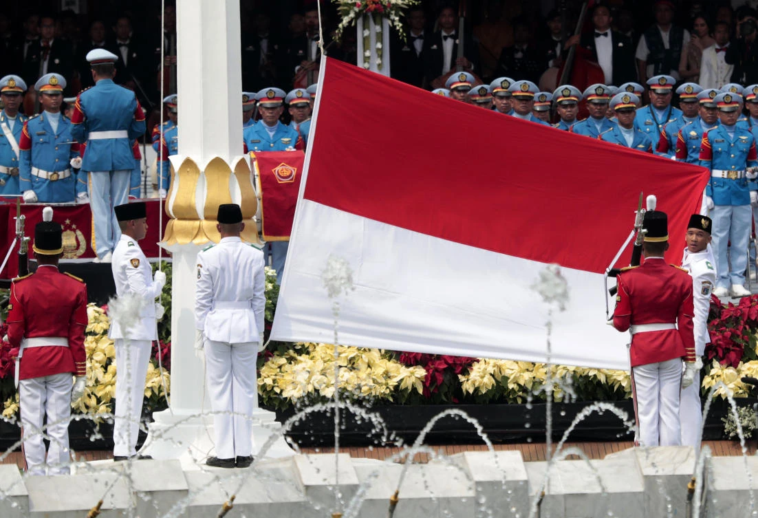 Former militants fly the flag for Indonesian independence