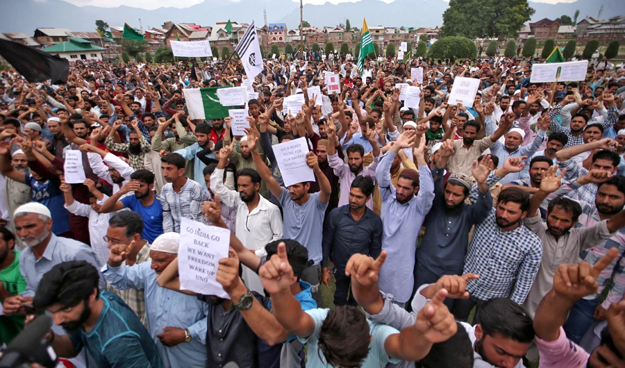Kashmiris hold placards as they shout slogans at a protest after Friday prayers during restrictions after the Indian government scrapped the special constitutional status for Kashmir, in Srinagar August 16, 2019. (Reuters)