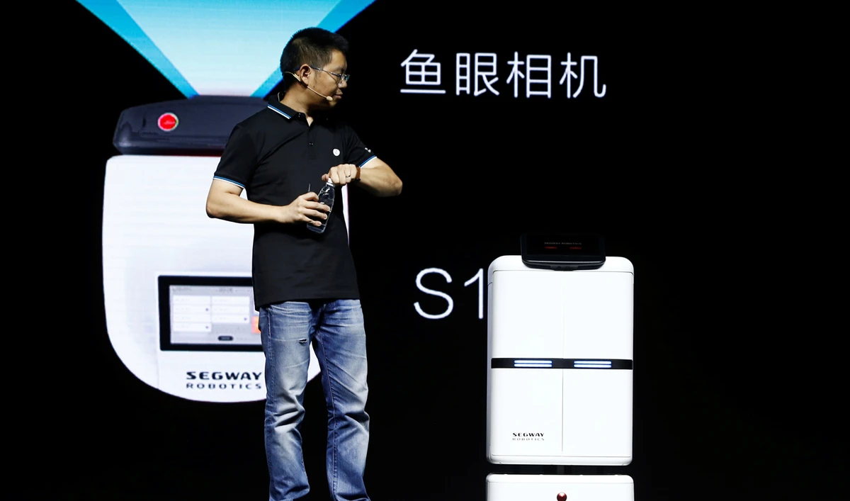 Ninebot President Wang Ye unveils delivery robot Segway DeliveryBot S2 at a Segway-Ninebot product launch event in Beijing. (Reuters)