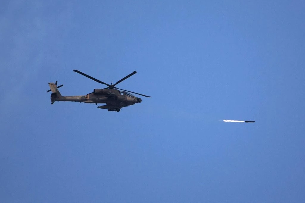An attack helicopter fired at ‘armed suspects’ along the barrier that separates Israel from the Gaza Strip. (AFP file photo)