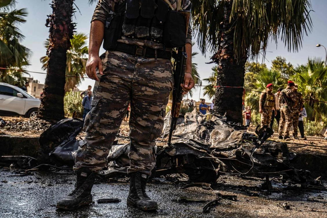 Security forces gather at the scene of a car bomb explosion in Qamishli in northeastern Syria’s Hasakah province on Sunday, August 18, 2019. (AFP)