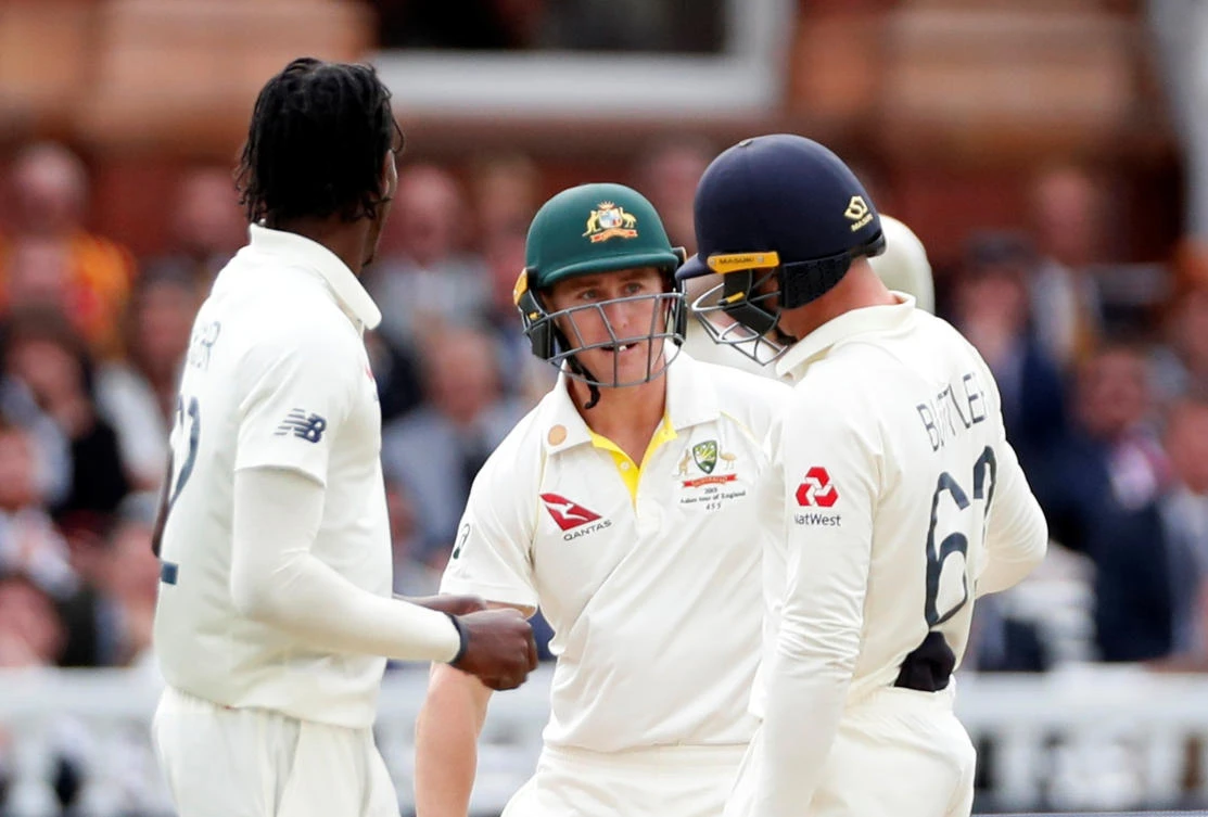 Australia’s Marnus Labuschagne speaks to England’s Jos Buttler after being hit by a ball from England’s Jofra Archer. Australia would go on to survive the onslaught and save the Test to remain 1-0 ahead in the Ashes series. (Action Images via Reuters)