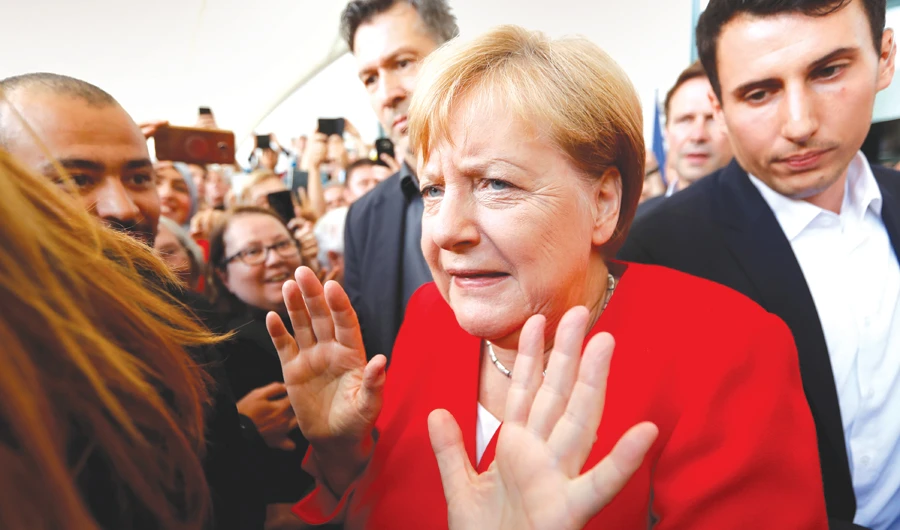 German Chancellor Angela Merkel gestures at her arrival for the government’s ‘Open Door Day’ in Berlin on Sunday Sam sit fuga. Et laut ute odi cum as elit. (Reuters)