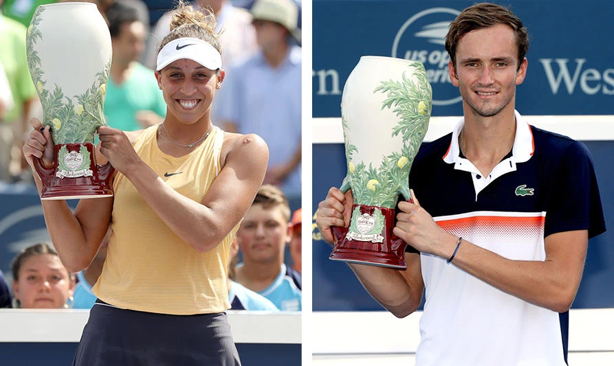 Madison Keys of the US, left frame, and Daniil Medvedev of Russia display their trophies at the Western & Southern Open in in Mason, Ohio on August 18, 2019. Keys defeated Svetlana Kuznetsova of Russia in the women's final and Medvedev beat David Goffin of Belgium in the men's final. (AFP photos)