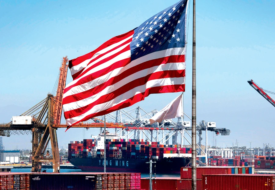 Cargo being unloaded from a ship at the Port of Long Beach, California. Latest data shows a mixed picture of the US economy. (AFP)
