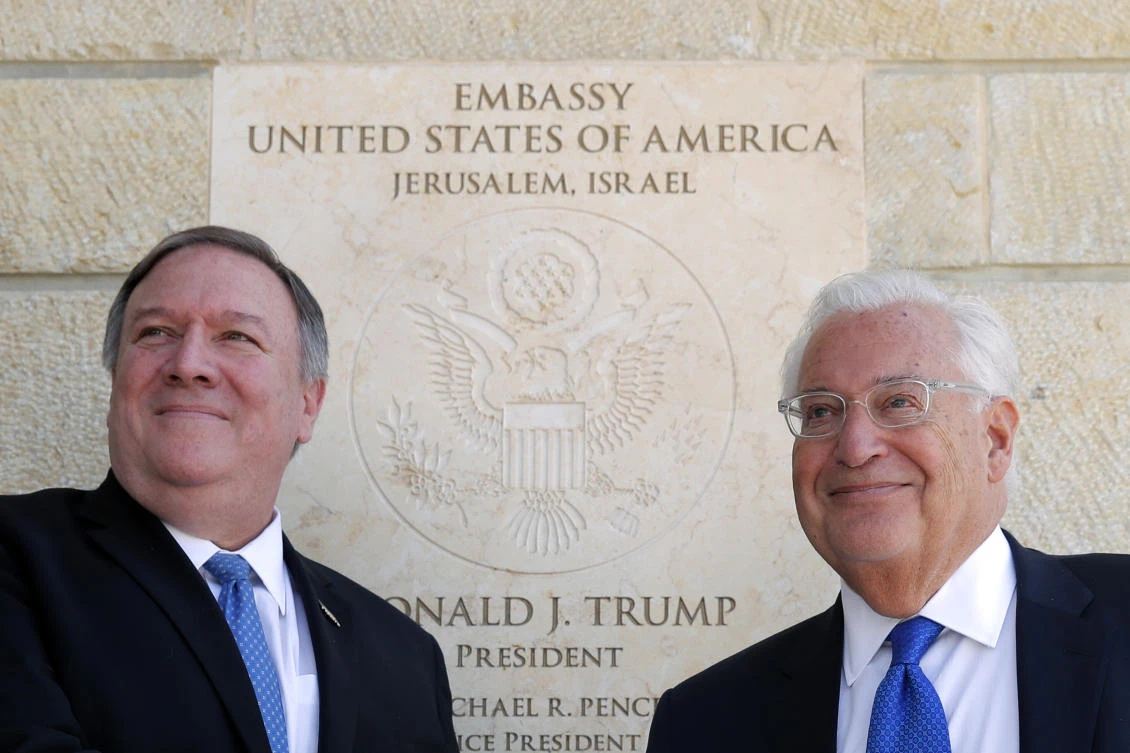 US Secretary of State Mike Pompeo and US Ambassador to Israel David Friedman stand next to the dedication plaque at the US Embassy in Jerusalem. The embassy was forced to postpone a conference it organized in Ramallah after Palestinian officials and factions called for a boycott and threatened to organize mass protests. (AP/File Photo)