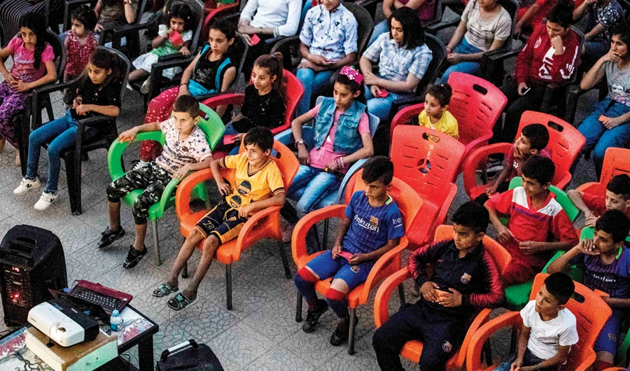 Mobile cinema brings movie magic to Syrian Kurd children
