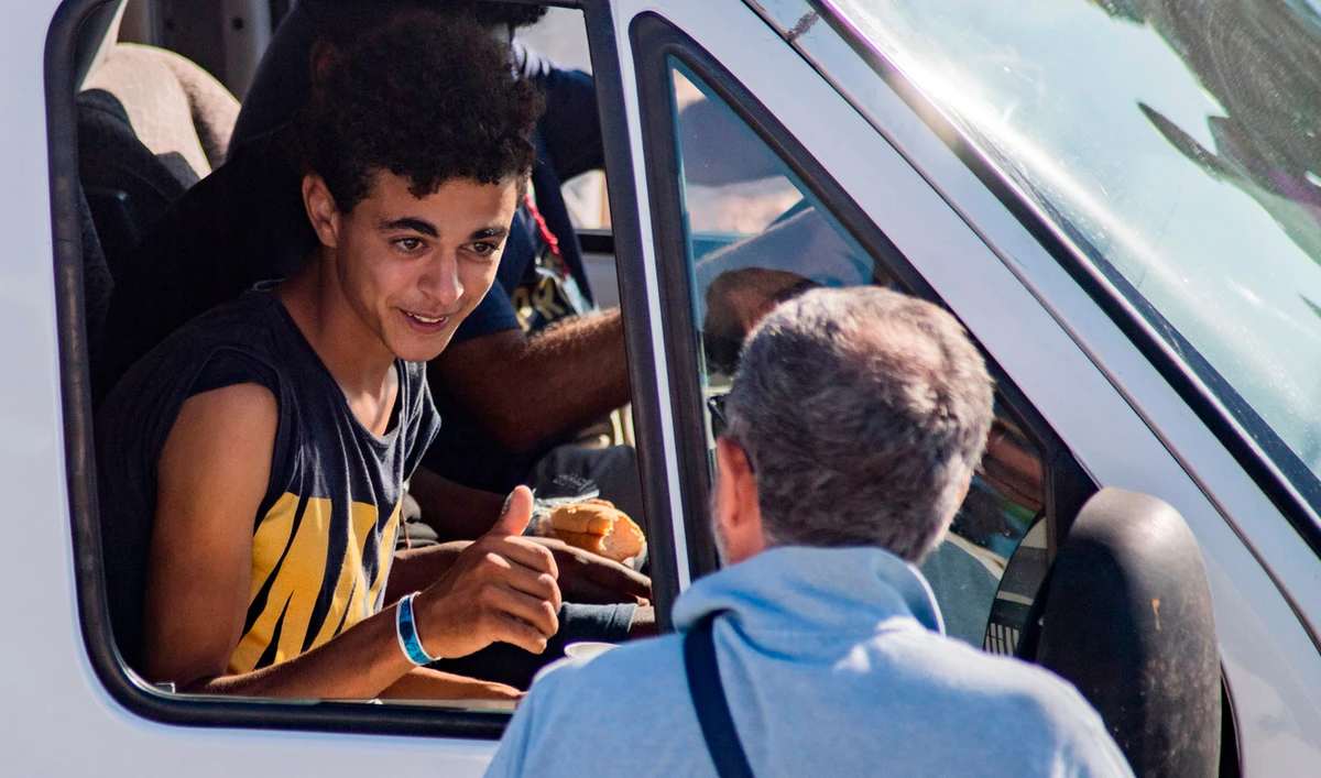The boat had spent six days anchored off Lampedusa before a local prosecutor ordered the migrants be allowed to land. (AFP)