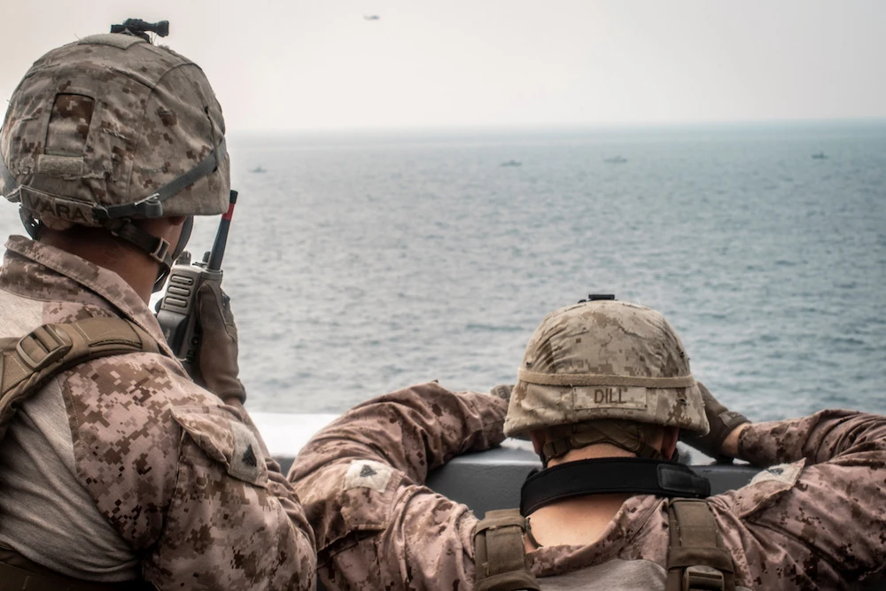 Marines watch nearby Iranian attack craft in the Strait of Hormuz. (AFP/File photo)