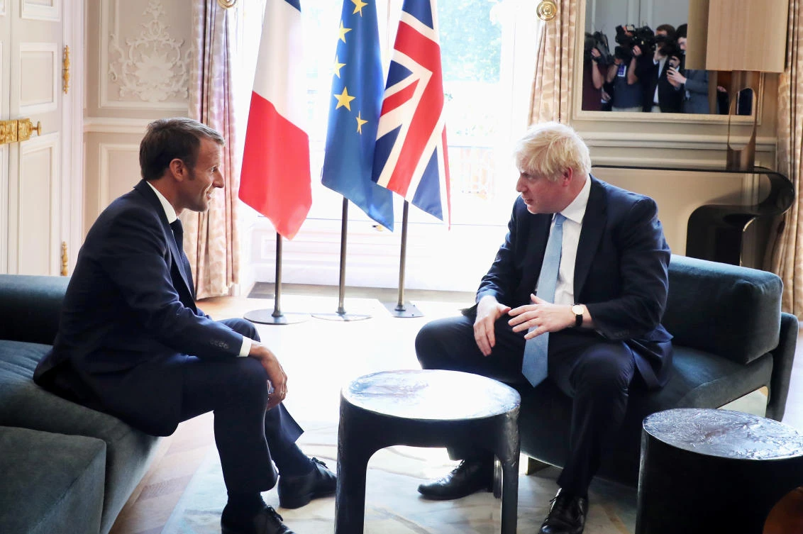French President Emmanuel Macron and British Prime Minister Boris Johnson speak during a meeting at the Elysee Palace in Paris, France, August 22, 2019. (Reuters)