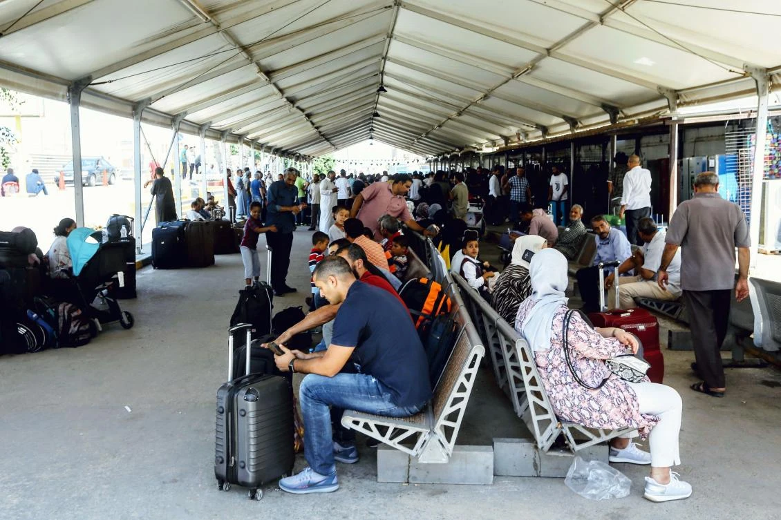 Passengers wait for their flights at the Mitiga International Airport in Libya's capital Tripoli on August 24, 2019, after a rocket hit the airport which suspended flights. (AFP)