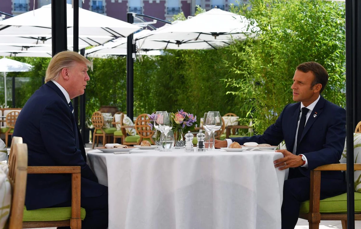 US President Donald Trump (L) sits to lunch with French President Emmanuel Macron at the Hotel du Palais in Biarritz, south-west France on August 24, 2019, on the first day of the annual G7 Summit. (AFP)
