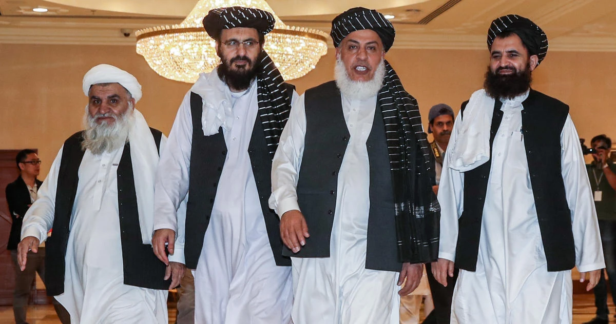 Members of the Taliban delegation walk during a previous round of talks in the Qatari capital Doha. (File/AFP)