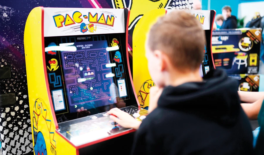 A boy plays the ‘Pacman’ retro game at the Gamescom gaming fair, the largest in Europe. (AFP)