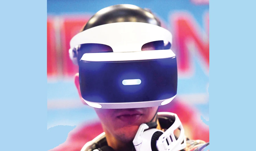 Window on the gaming world: A visitor at a Sony Playstation booth at the Gamescom trade fair in Cologne. (AFP)